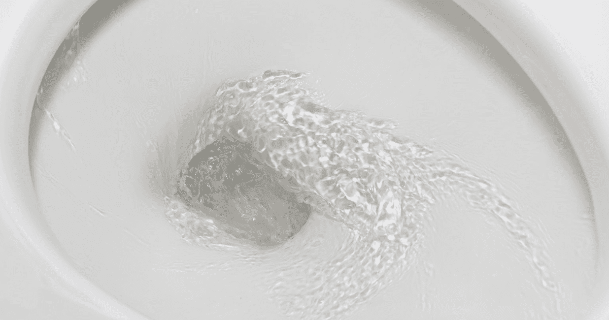 Motion blur of flushing water in toilet bowl